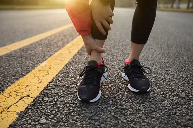 A woman getting ankle sprain injury while jogging