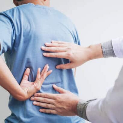 chiropractor consulting a with patient Back problems 