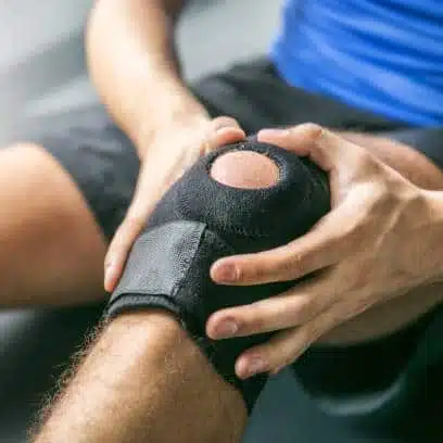 athlete wearing some knee pad armor to protect his knee while playing 