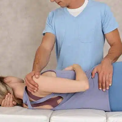Chiropractor is doing some Decompression therapy to the patient. 