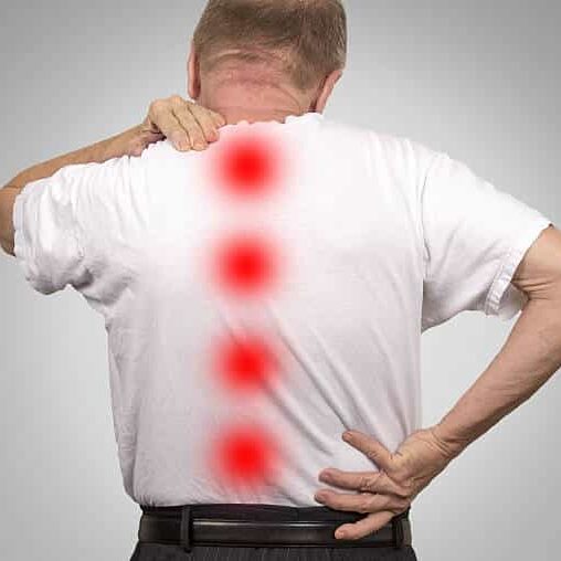 Senior elderly man suffers from Spinal Stenosis