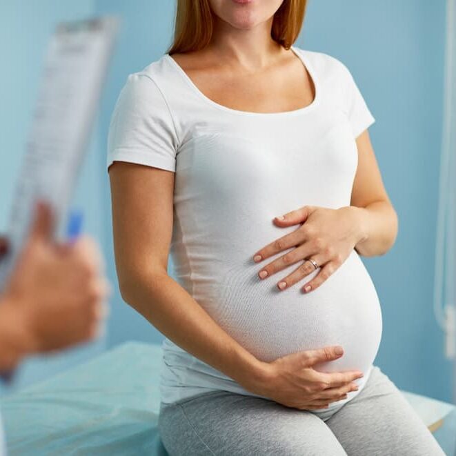 Expecting mother during pregnancy consultation.