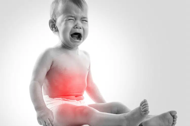 Young baby boy cries feeling uncomfortable suffering from Digestive Issues | pediatric chiropractic care in columbus