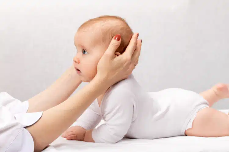 Baby receiving wellness treatment and support | pediatric chiropractic care in columbus