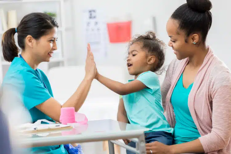 Mother and daughter having interaction with their pediatric chiropractic care in columbus