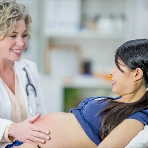 Pregnant woman receiving prenatal chiropractic care in columbus