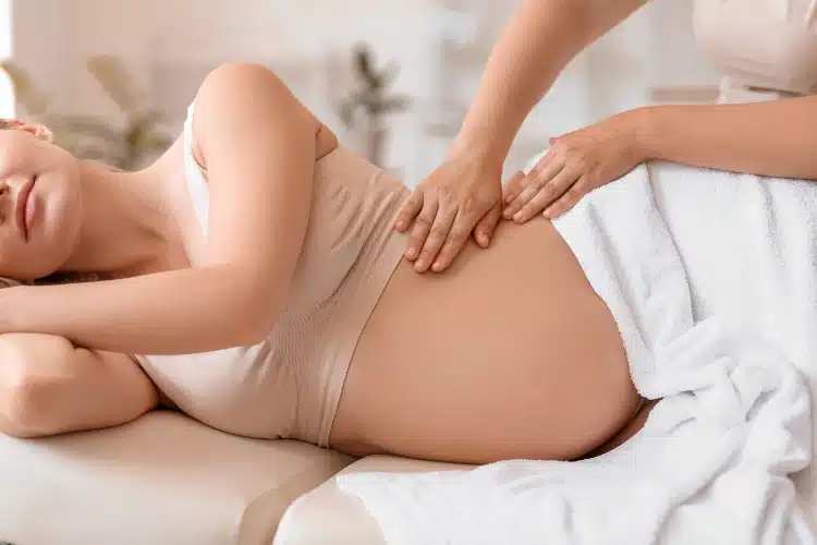 Pregnant woman receiving prenatal chiropractic care in columbus