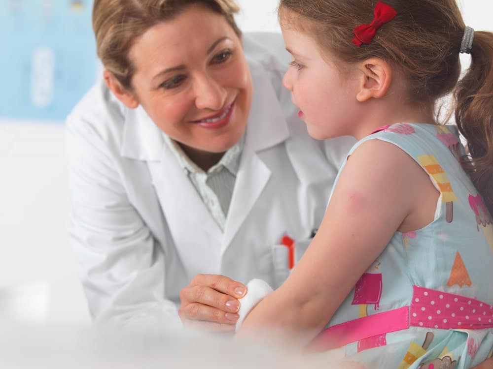 Pediatric chiropractor caring for a young patient.