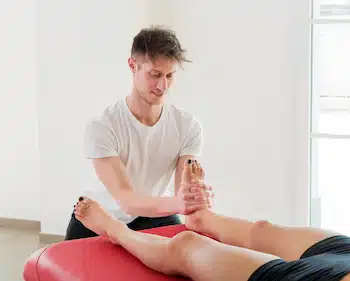 Experienced chiropractor performing a  foot and ankle pain treatment in columbus ne