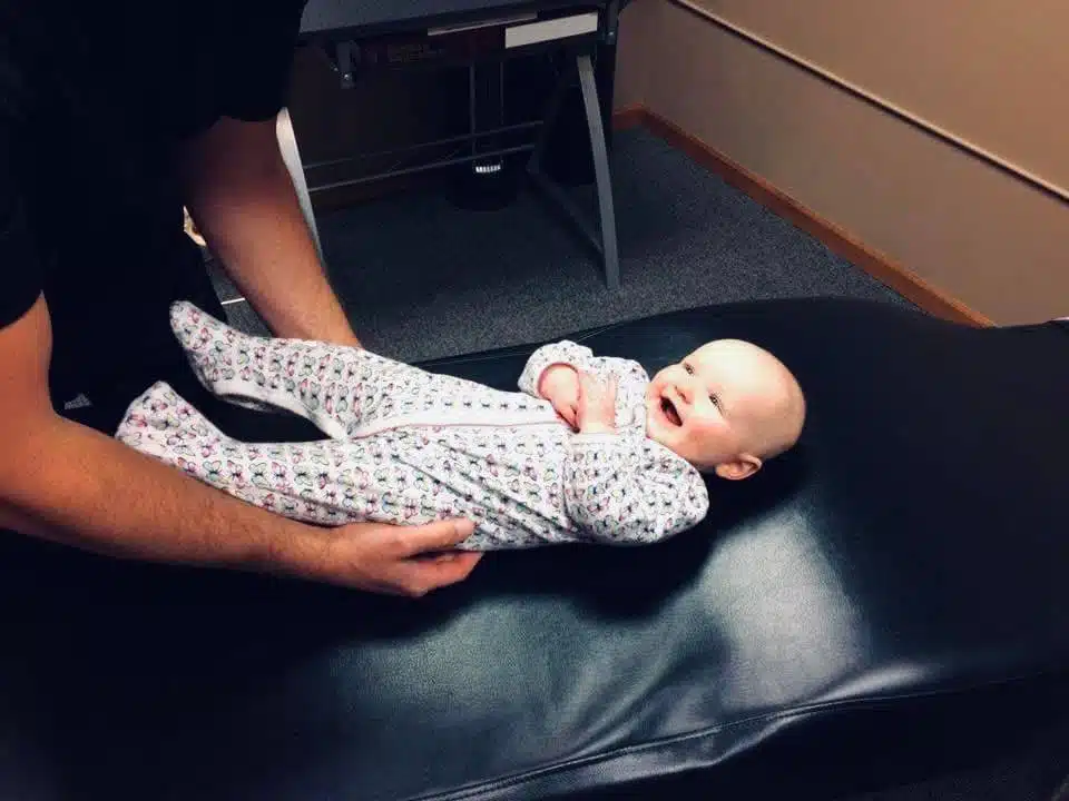 Baby receiving pediatric chiropractic care in columbus