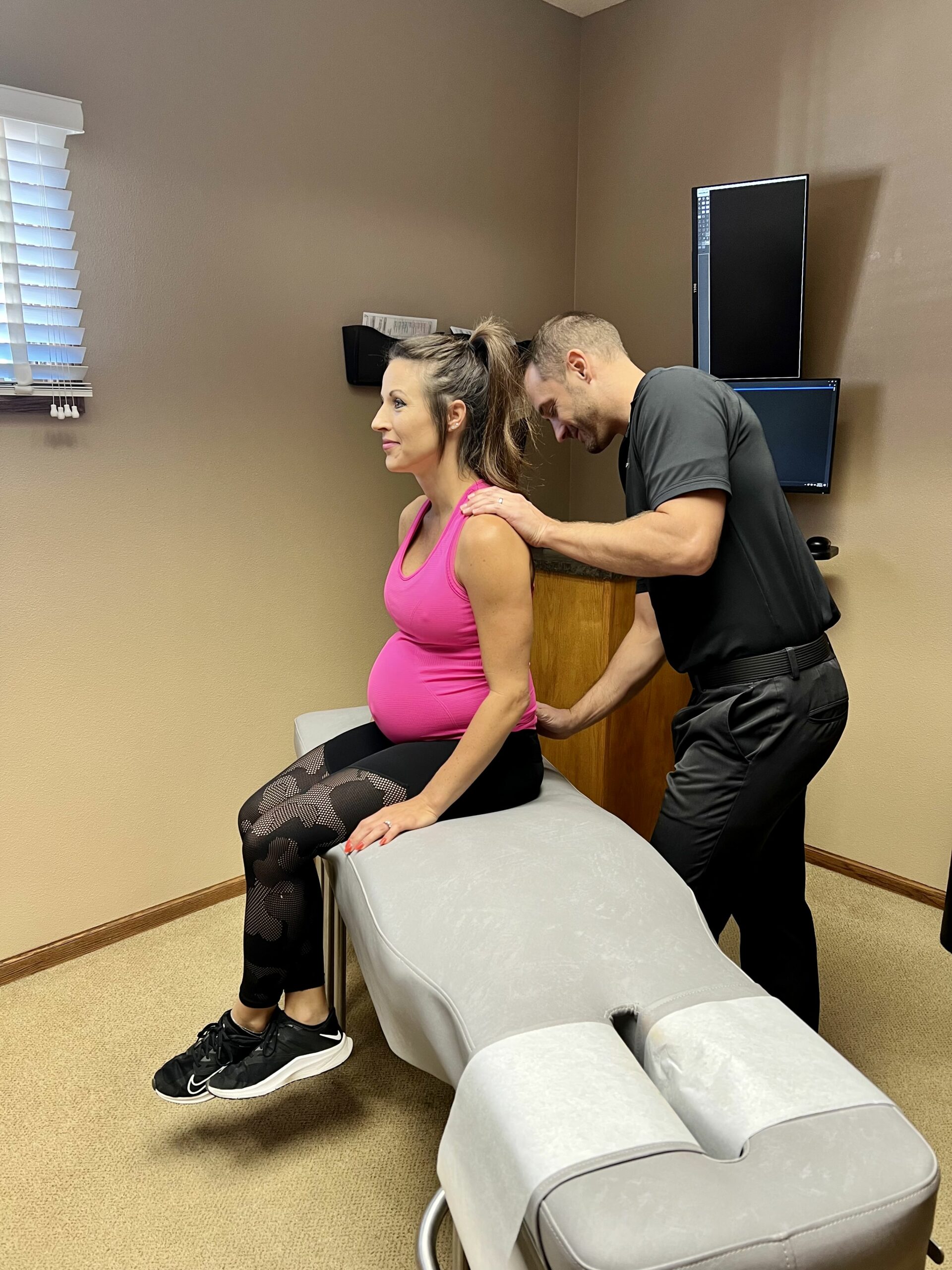 Pregnant woman receiving prenatal chiropractic care in columbus
