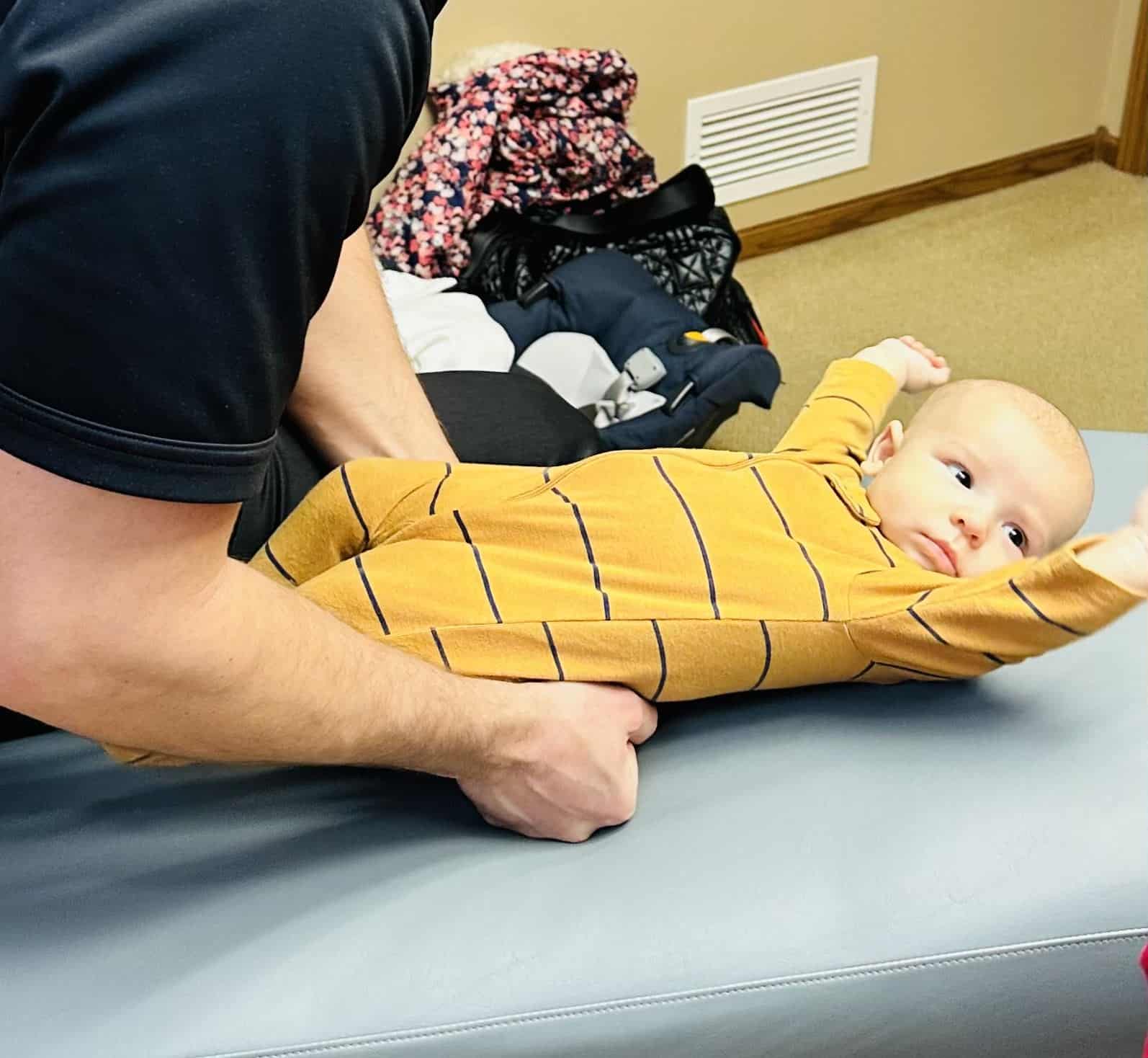 Baby receiving Soft Tissue Therapy | pediatric chiropractic care in columbus