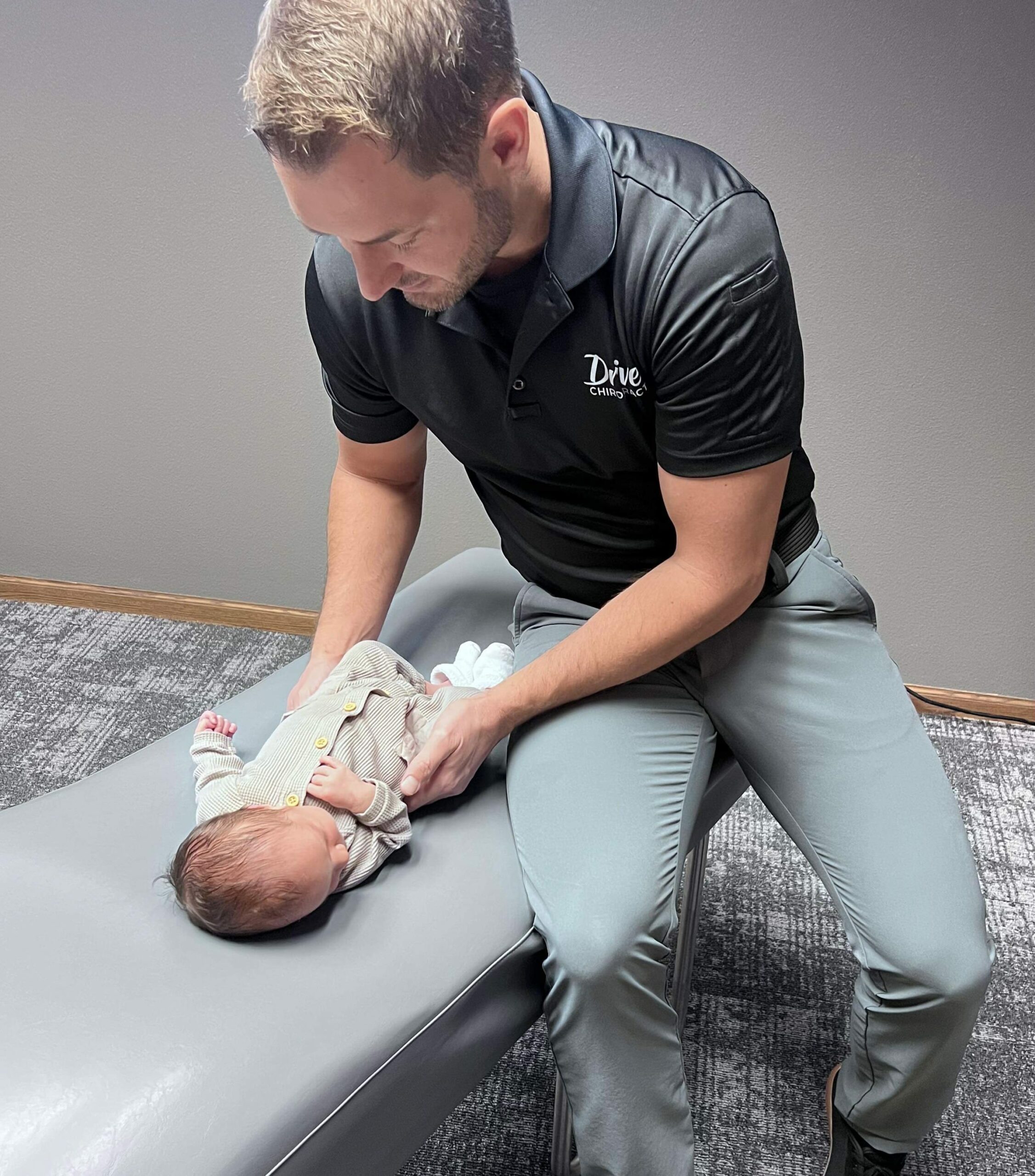 Baby receiving wellness treatment and support | pediatric chiropractic care in columbus