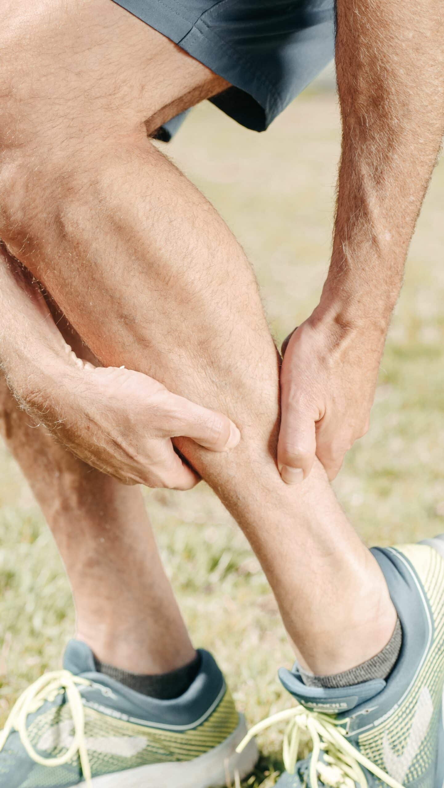 One leg with redness and swelling indicating potential blood clot in deep veins.